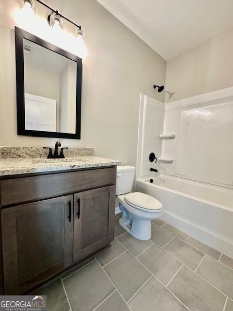 full bath with vanity, toilet, shower / bath combination, and tile patterned flooring