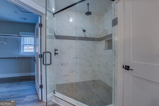 141G Lake Pines Rd, Jackson, GA 30233 - bathroom with a shower stall, wood finished floors, and baseboards