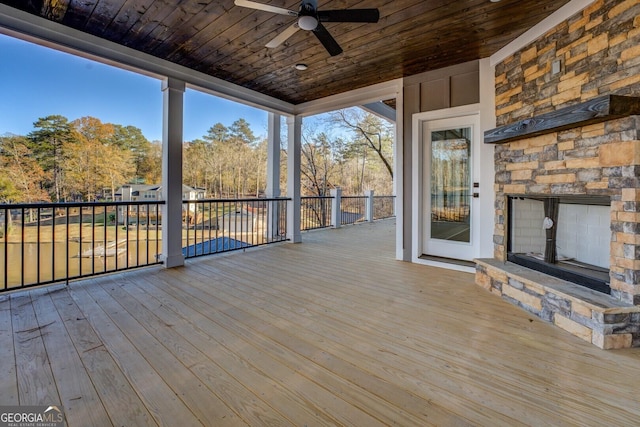 141G Lake Pines Rd, Jackson, GA 30233 - wooden terrace featuring ceiling fan and an outdoor stone fireplace