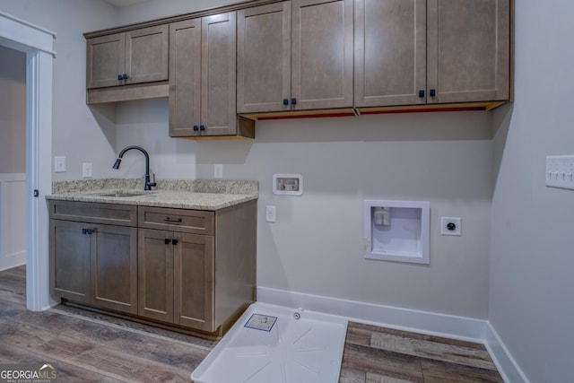 141G Lake Pines Rd, Jackson, GA 30233 - laundry room with hookup for an electric dryer, cabinet space, washer hookup, wood finished floors, and hookup for a gas dryer