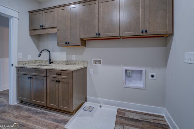 141G Lake Pines Rd, Jackson, GA 30233 - laundry area featuring hookup for an electric dryer, hookup for a washing machine, wood finished floors, cabinet space, and hookup for a gas dryer