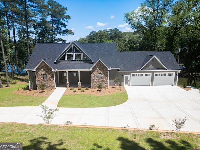 141G Lake Pines Rd, Jackson, GA 30233 - craftsman inspired home featuring stone siding, board and batten siding, an attached garage, and a front lawn