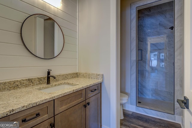 141G Lake Pines Rd, Jackson, GA 30233 - bathroom with toilet, wood finished floors, a shower stall, and vanity
