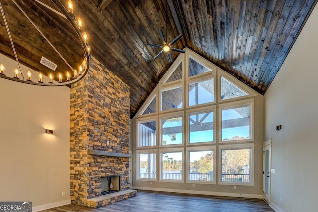 141G Lake Pines Rd, Jackson, GA 30233 - unfurnished living room with high vaulted ceiling, wooden ceiling, dark wood-style flooring, a stone fireplace, and baseboards
