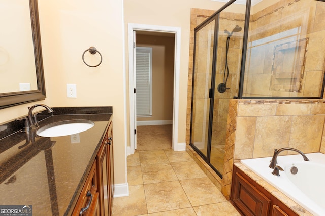 full bath with a shower stall, a garden tub, and baseboards