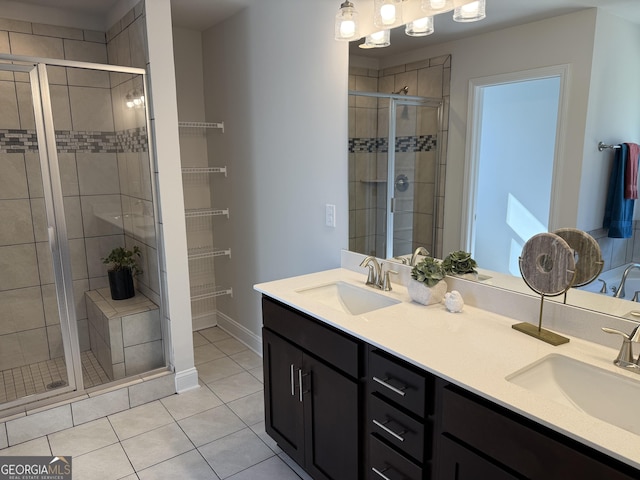 115 Vineyard Walk Lot 76, Carrollton, GA 30117 - full bathroom with a stall shower, tile patterned flooring, double vanity, and baseboards