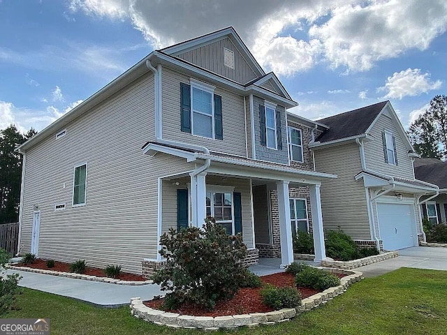 264 Harmony Blvd, Pooler, GA 31322 - view of front of house featuring covered porch, an attached garage, board and batten siding, and driveway