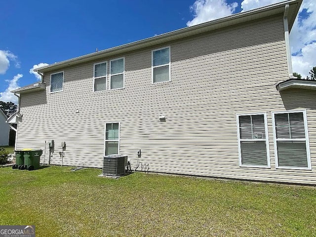 264 Harmony Blvd, Pooler, GA 31322 - rear view of house featuring central AC and a yard