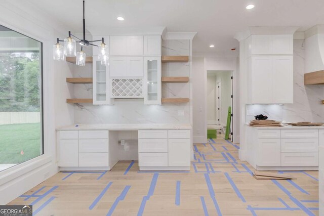 kitchen with open shelves, white cabinets, backsplash, light countertops, and recessed lighting