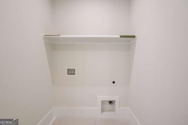 washroom with hookup for a washing machine, hookup for an electric dryer, baseboards, and tile patterned flooring
