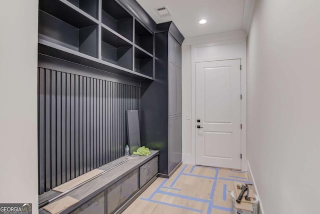 mudroom featuring inlaid floor details, baseboards, and recessed lighting