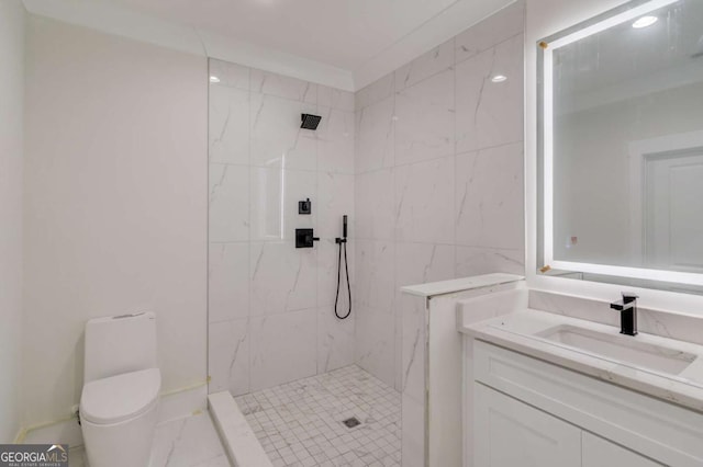 full bath featuring a marble finish shower, vanity, and toilet