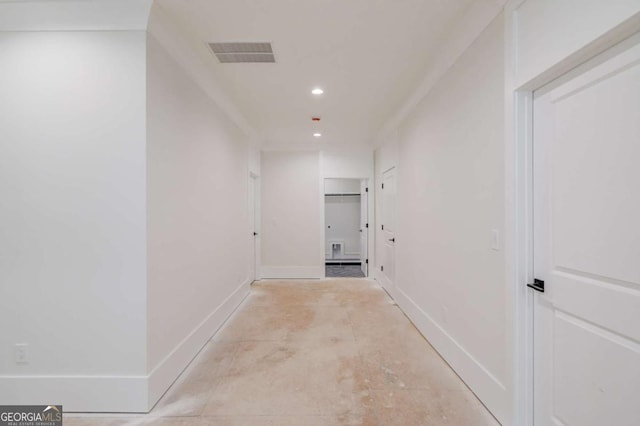 corridor with recessed lighting and baseboards