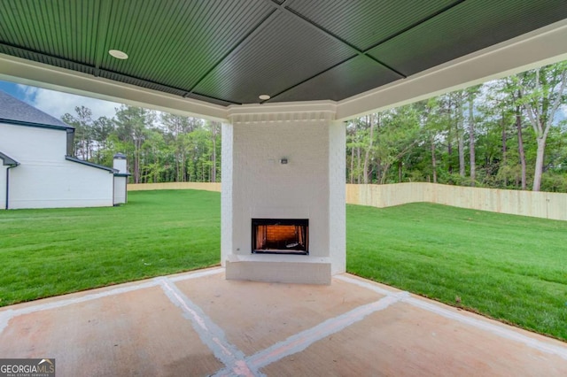 view of patio / terrace featuring an outdoor brick fireplace