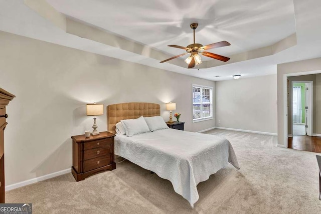 272 Blackberry Ln, Pendergrass, GA 30567 - bedroom featuring light carpet, a raised ceiling, and ceiling fan