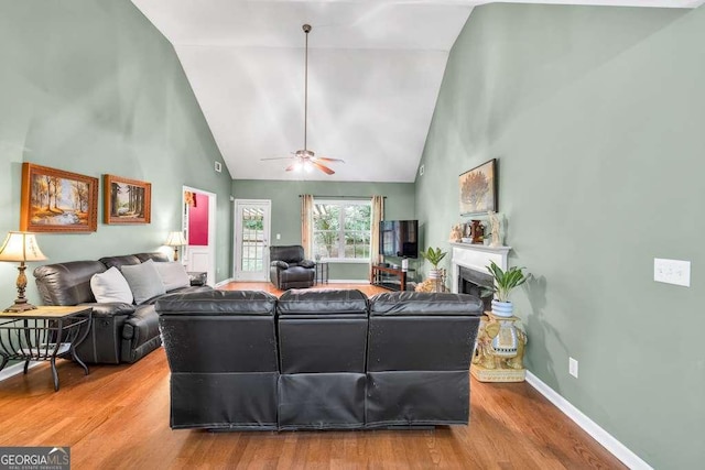272 Blackberry Ln, Pendergrass, GA 30567 - living area with high vaulted ceiling, wood finished floors, a fireplace, and ceiling fan