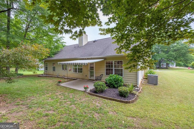 272 Blackberry Ln, Pendergrass, GA 30567 - rear view of house with a patio area, a lawn, and a chimney
