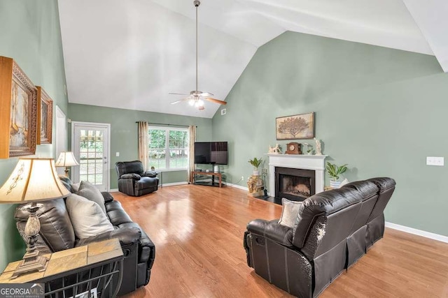 272 Blackberry Ln, Pendergrass, GA 30567 - living area with ceiling fan, high vaulted ceiling, wood finished floors, and a fireplace with flush hearth