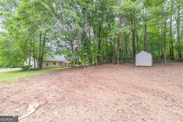 272 Blackberry Ln, Pendergrass, GA 30567 - view of yard with a shed