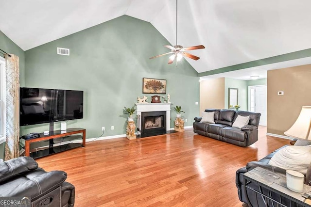 272 Blackberry Ln, Pendergrass, GA 30567 - living room with high vaulted ceiling, ceiling fan, wood finished floors, and a fireplace with flush hearth