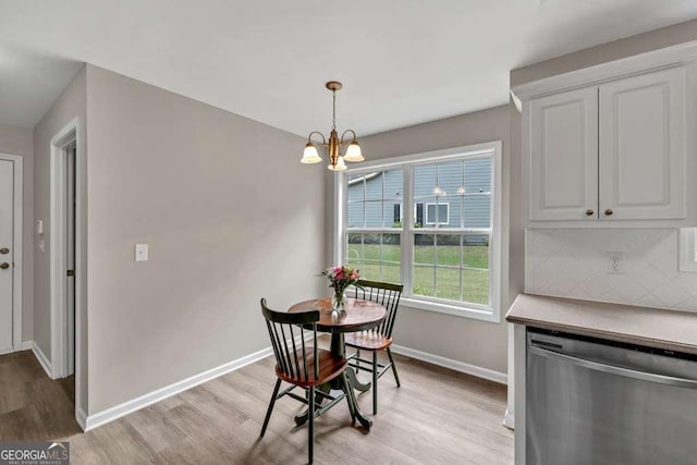 272 Blackberry Ln, Pendergrass, GA 30567 - dining space with light wood finished floors and a chandelier