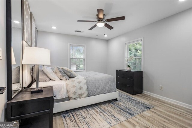 4134 Burgess Dr, Decatur, GA 30035 - bedroom with multiple windows, light wood-style flooring, baseboards, ceiling fan, and recessed lighting