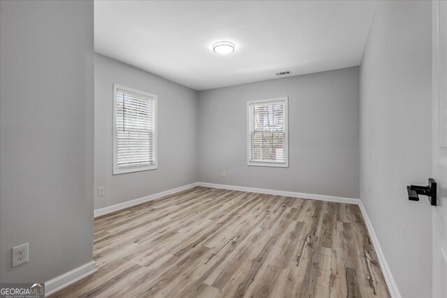 4134 Burgess Dr, Decatur, GA 30035 - unfurnished room with wood finished floors and baseboards