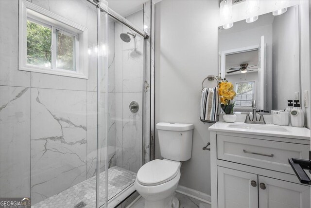4134 Burgess Dr, Decatur, GA 30035 - bathroom with toilet, a marble finish shower, vanity, a ceiling fan, and marble look tile flooring