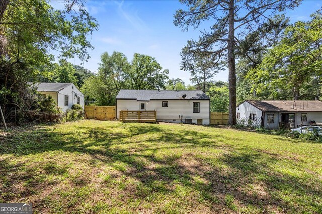 4134 Burgess Dr, Decatur, GA 30035 - back of house with crawl space and a wooden deck