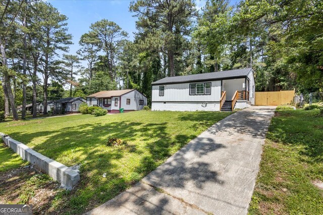 4134 Burgess Dr, Decatur, GA 30035 - view of front of property featuring concrete driveway, view of scattered trees, and crawl space