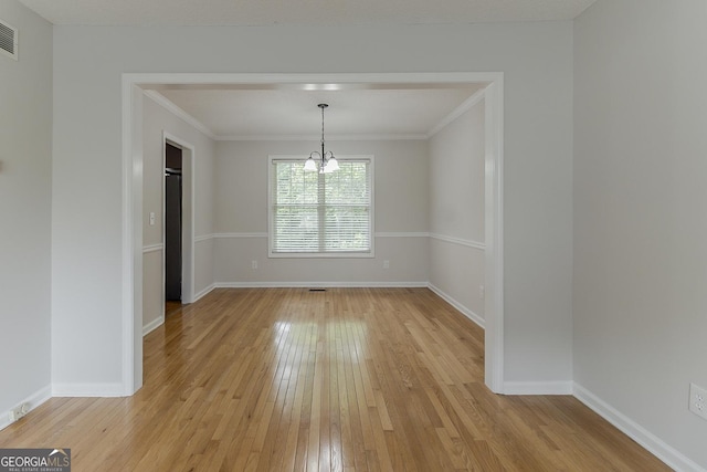 3717 Lockerbie Ln, Powder Springs, GA 30127 - unfurnished dining area featuring light wood-style flooring, a chandelier, baseboards, and ornamental molding