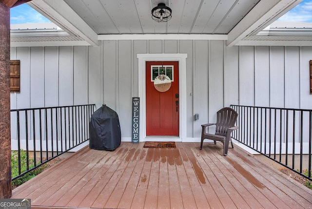 entrance to property featuring board and batten siding and a porch