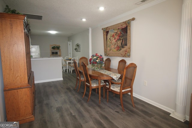 3024 Orchard Ridge Cir, Duluth, GA 30096 - dining space with ornate columns, dark wood-type flooring, recessed lighting, crown molding, and a textured ceiling