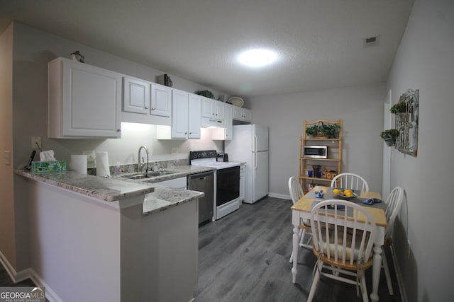 3024 Orchard Ridge Cir, Duluth, GA 30096 - kitchen featuring appliances with stainless steel finishes, exhaust hood, wood finished floors, light stone counters, and a peninsula