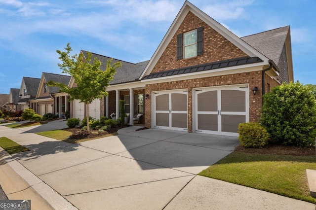 view of front of property featuring brick siding, concrete driveway, a standing seam roof, a shingled roof, and a front yard
