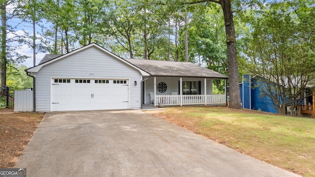 4771 Pinefield Dr NW, Acworth, GA 30102 - view of front of house with a porch, asphalt driveway, an attached garage, and roof with shingles