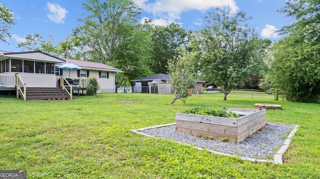 254 Merilyn Dr, Ringgold, GA 30736 - view of yard with a sunroom, a vegetable garden, stairway, and a deck