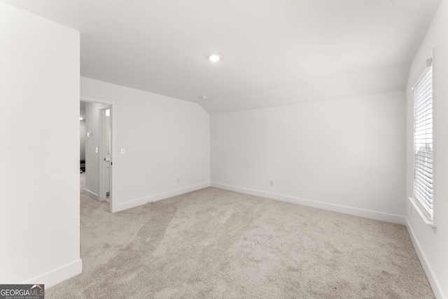 207 Hickory Bluffs Pkwy, Canton, GA 30114 - carpeted spare room featuring baseboards and lofted ceiling