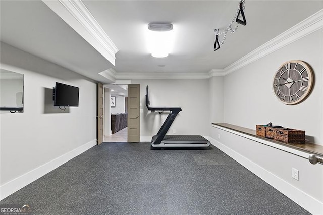 workout area with ornamental molding and baseboards