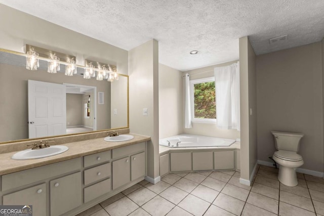 2620 Dr Bramblett Rd, Cumming, GA 30028 - bathroom featuring baseboards, tile patterned floors, a garden tub, double vanity, and toilet