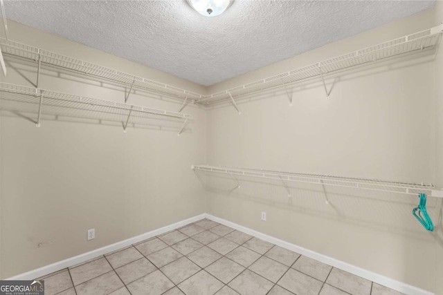 2620 Dr Bramblett Rd, Cumming, GA 30028 - walk in closet with light tile patterned floors