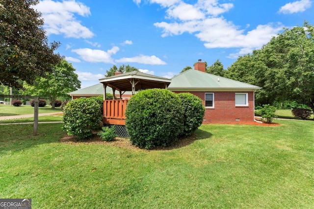 2620 Dr Bramblett Rd, Cumming, GA 30028 - view of side of home featuring a yard, a chimney, brick siding, and a gazebo