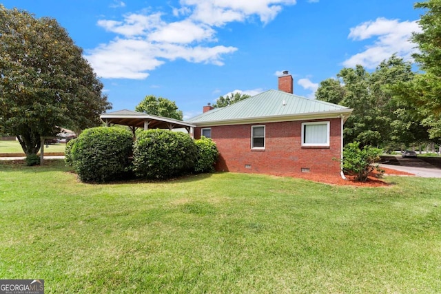 2620 Dr Bramblett Rd, Cumming, GA 30028 - view of property exterior featuring a chimney, crawl space, brick siding, and a lawn