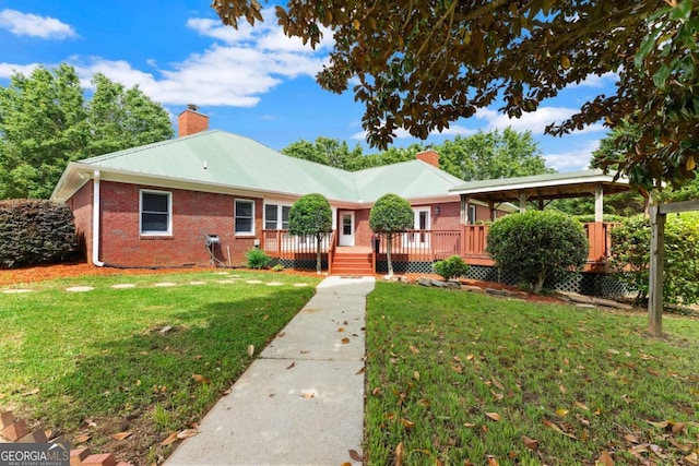 2620 Dr Bramblett Rd, Cumming, GA 30028 - ranch-style house with a chimney, brick siding, a wooden deck, and a front yard
