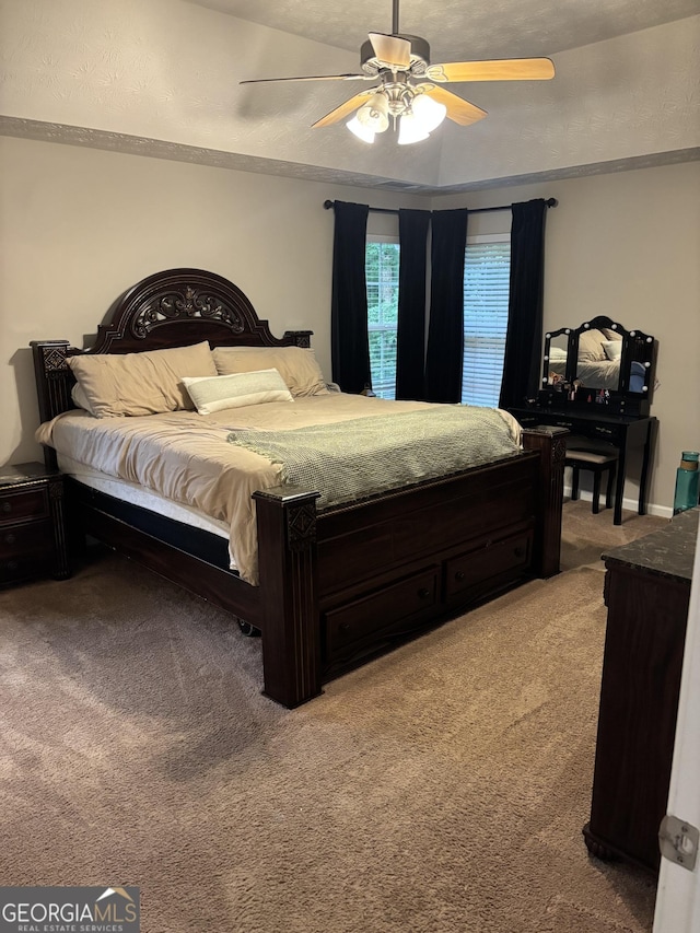 bedroom featuring light colored carpet, ceiling fan, and crown molding