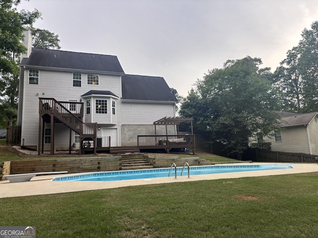 back of house featuring a deck, a pergola, stairs, and a chimney