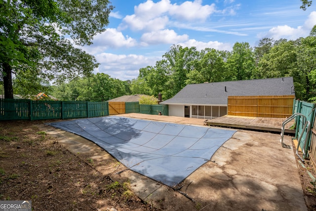 121 Stonewood Dr, Toccoa, GA 30577 - view of swimming pool featuring a wooden deck, a fenced backyard, a sunroom, and a patio area
