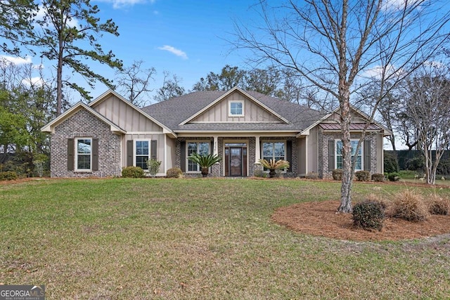 4227 Tillman Blf, Valdosta, GA 31602 - craftsman-style house featuring board and batten siding, brick siding, a front yard, and roof with shingles