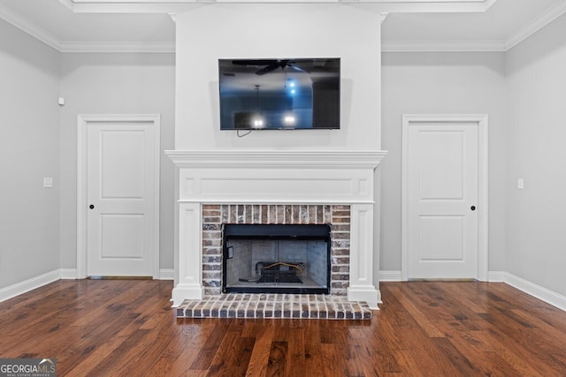 4227 Tillman Blf, Valdosta, GA 31602 - detailed view of wood finished floors, crown molding, baseboards, and a brick fireplace