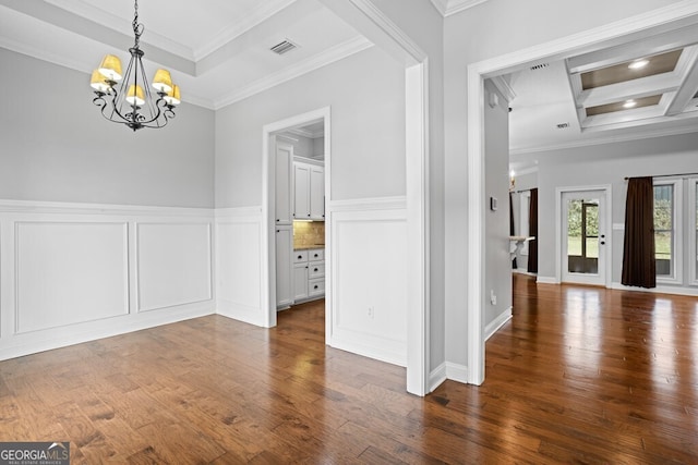 4227 Tillman Blf, Valdosta, GA 31602 - unfurnished dining area with a chandelier, ornamental molding, dark wood-style floors, a decorative wall, and a wainscoted wall